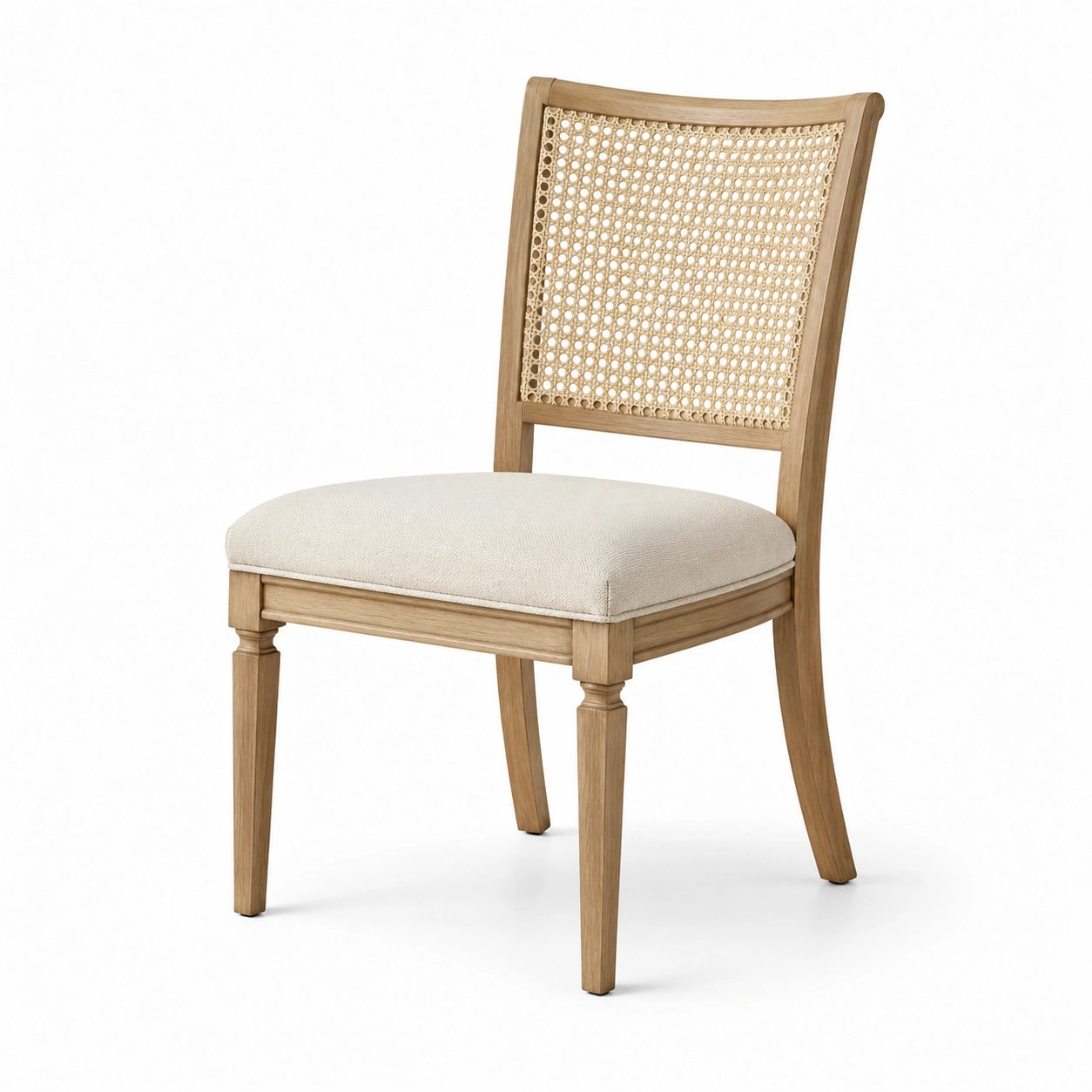 Sedia in legno chiaro con seduta imbottita e schienale in rattan